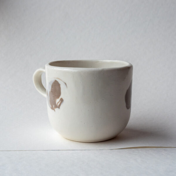 Skaite Mug 08 that got too friendly with the kiln shelves